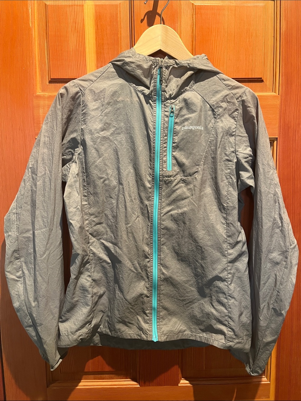 Patagonia Houdini Women's Gray Hooded Jacket with Teal Zipper Accents